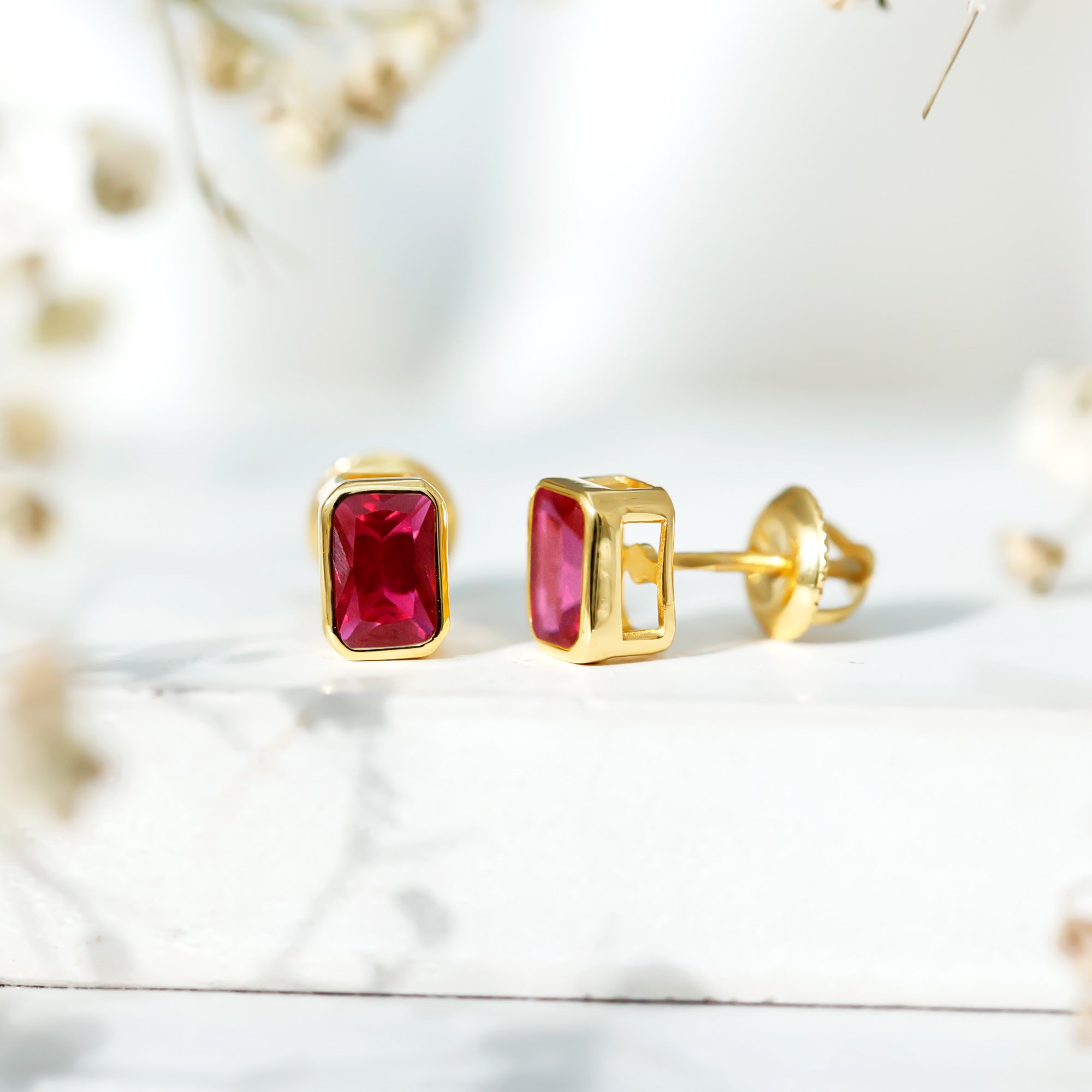1.5 Carat Emerald Cut Lab Grown Ruby Stud Earrings in Bezel Set AAAA 14K Yellow Gold Plated Silver - Rosec Jewels