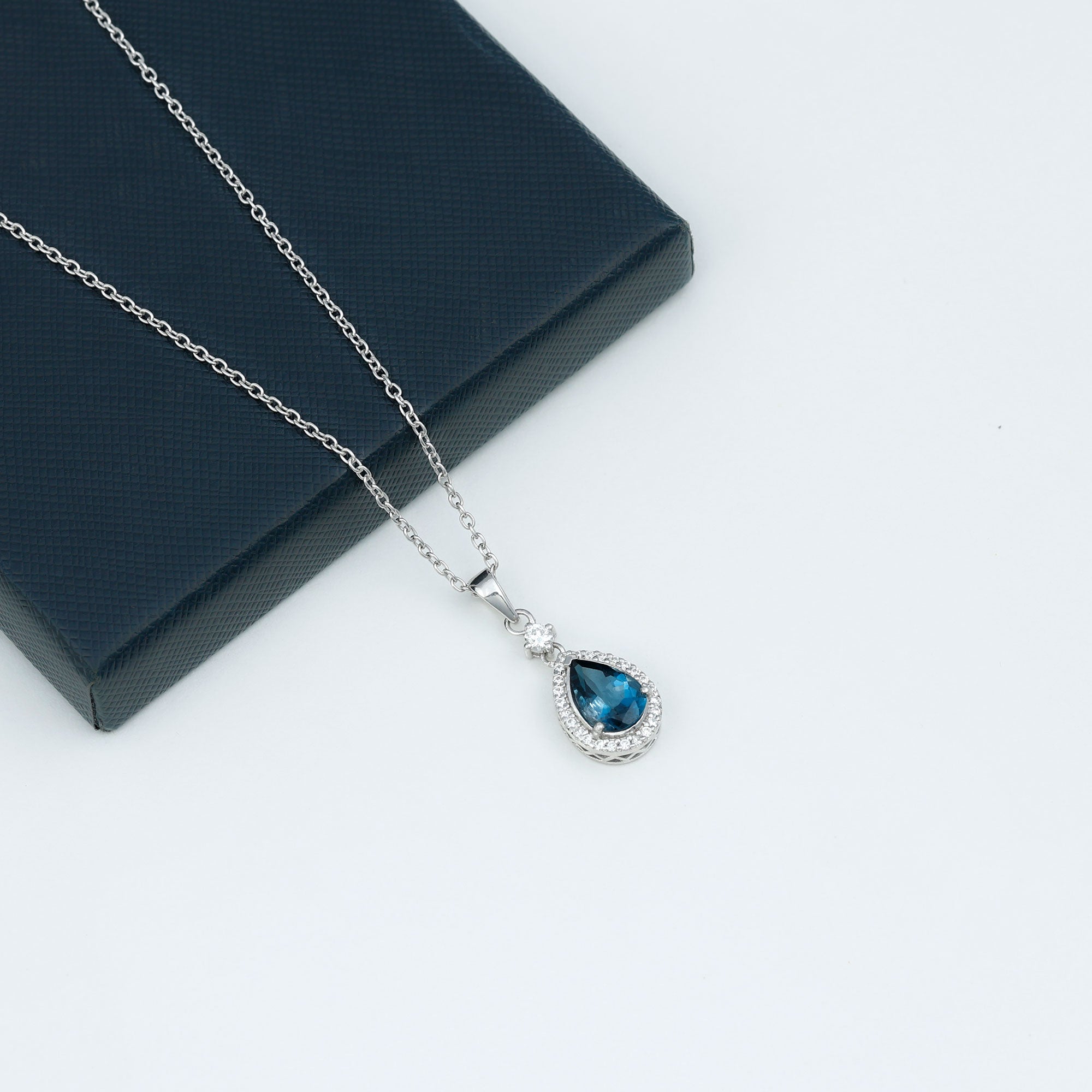 4.25 CT London Blue Topaz and Moissanite Halo Pendant Necklace in Silver - Rosec Jewels