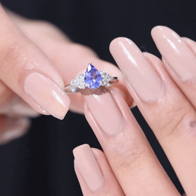 0.8 Carat Pear Shaped Tanzanite Engagement Ring with Diamond Trio AAA - Rosec Jewels
