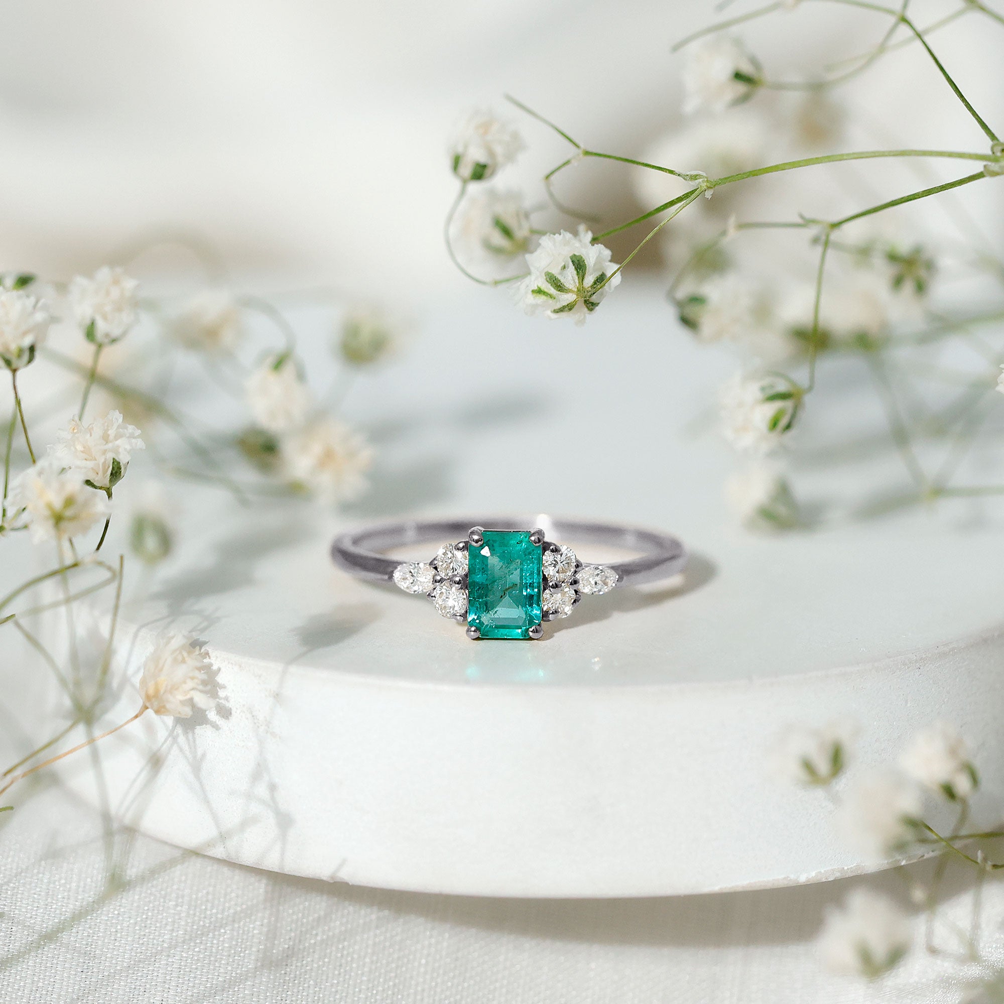 Rosec Jewels-Emerald Cut Emerald Engagement Ring with Diamond Trio
