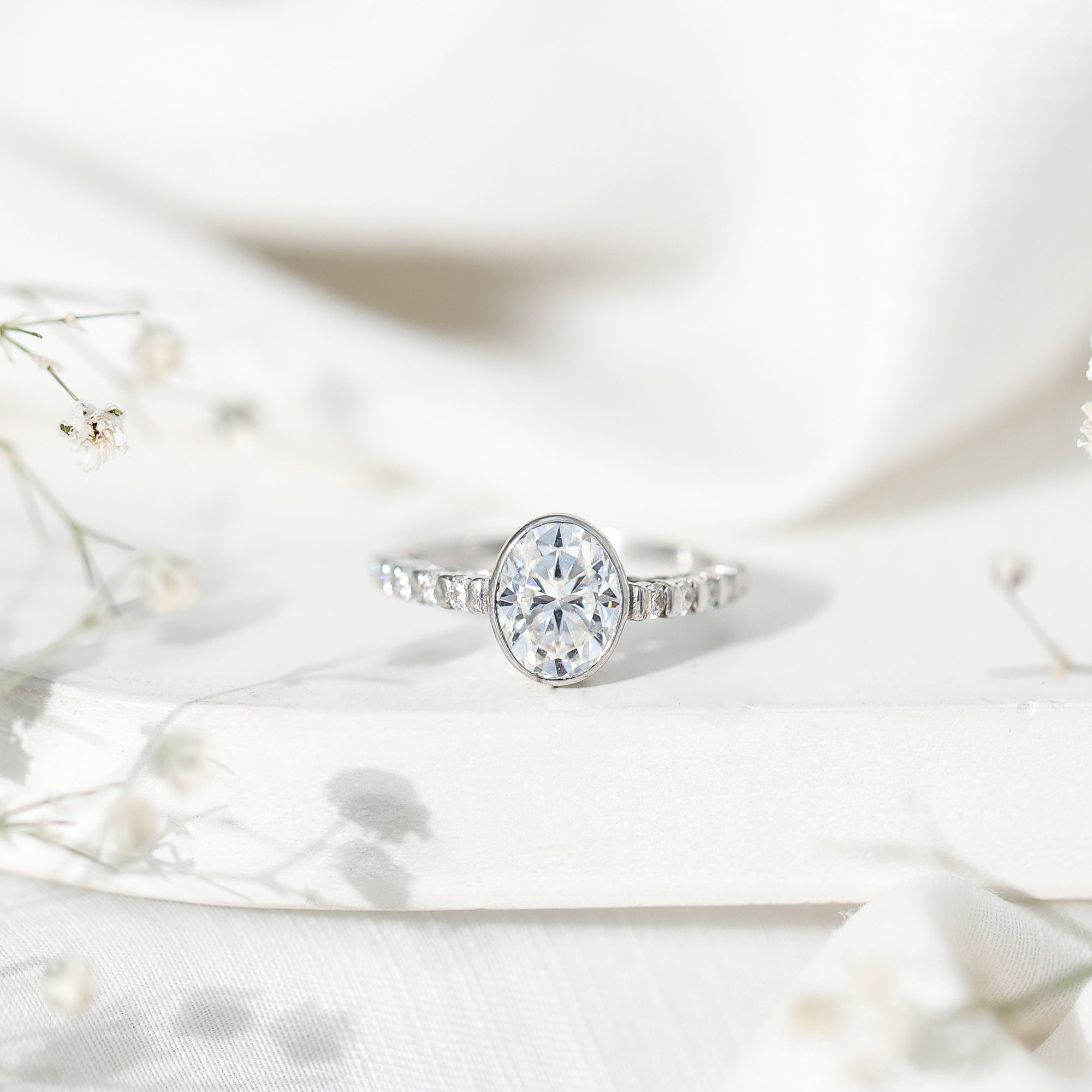 Bezel Set Moissanite Oval Engagement Ring with Side Stones D-VS1 - Rosec Jewels