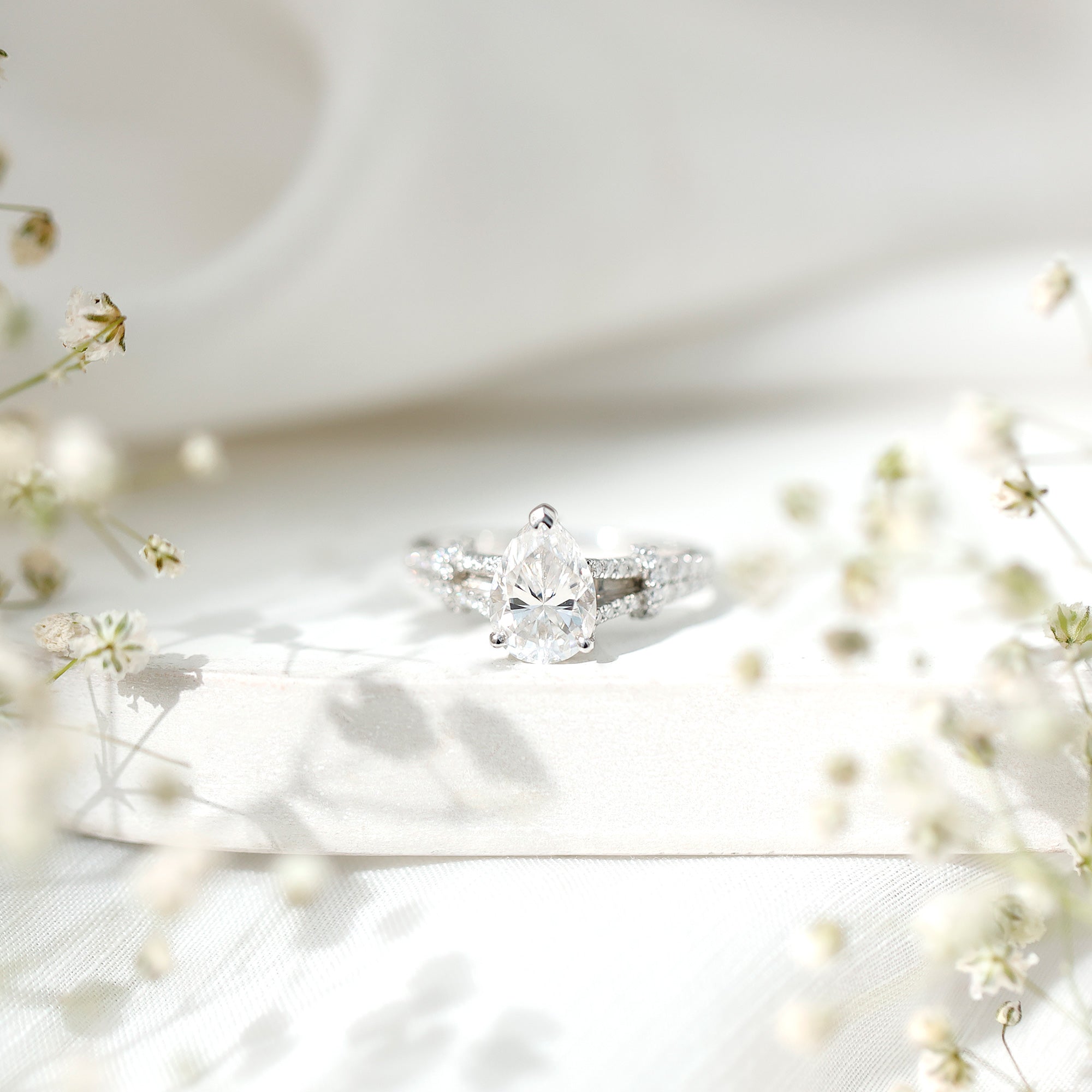 Rosec Jewels-Pear Shaped Moissanite Solitaire Engagement Ring in Split Shank