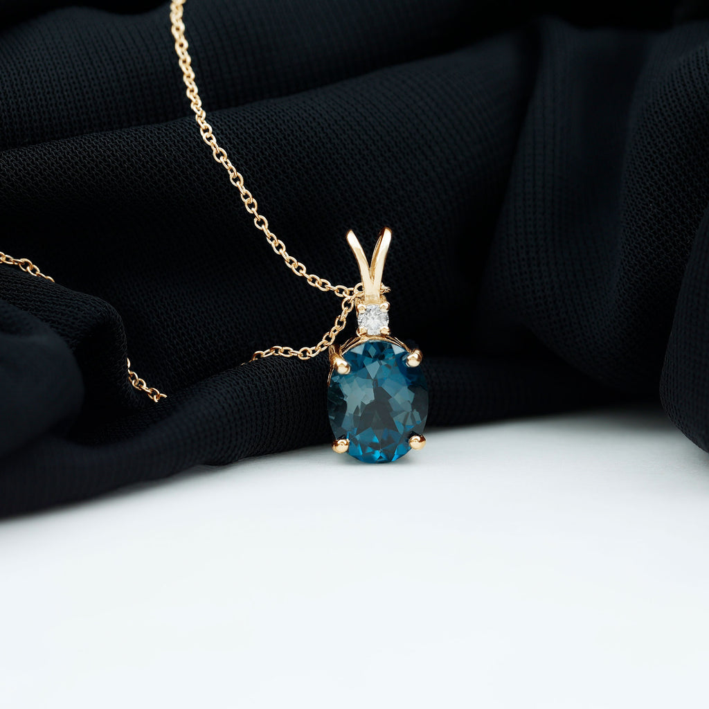 Oval London Blue Topaz Solitaire Pendant with Round Moissanite London Blue Topaz - ( AAA ) - Quality - Rosec Jewels