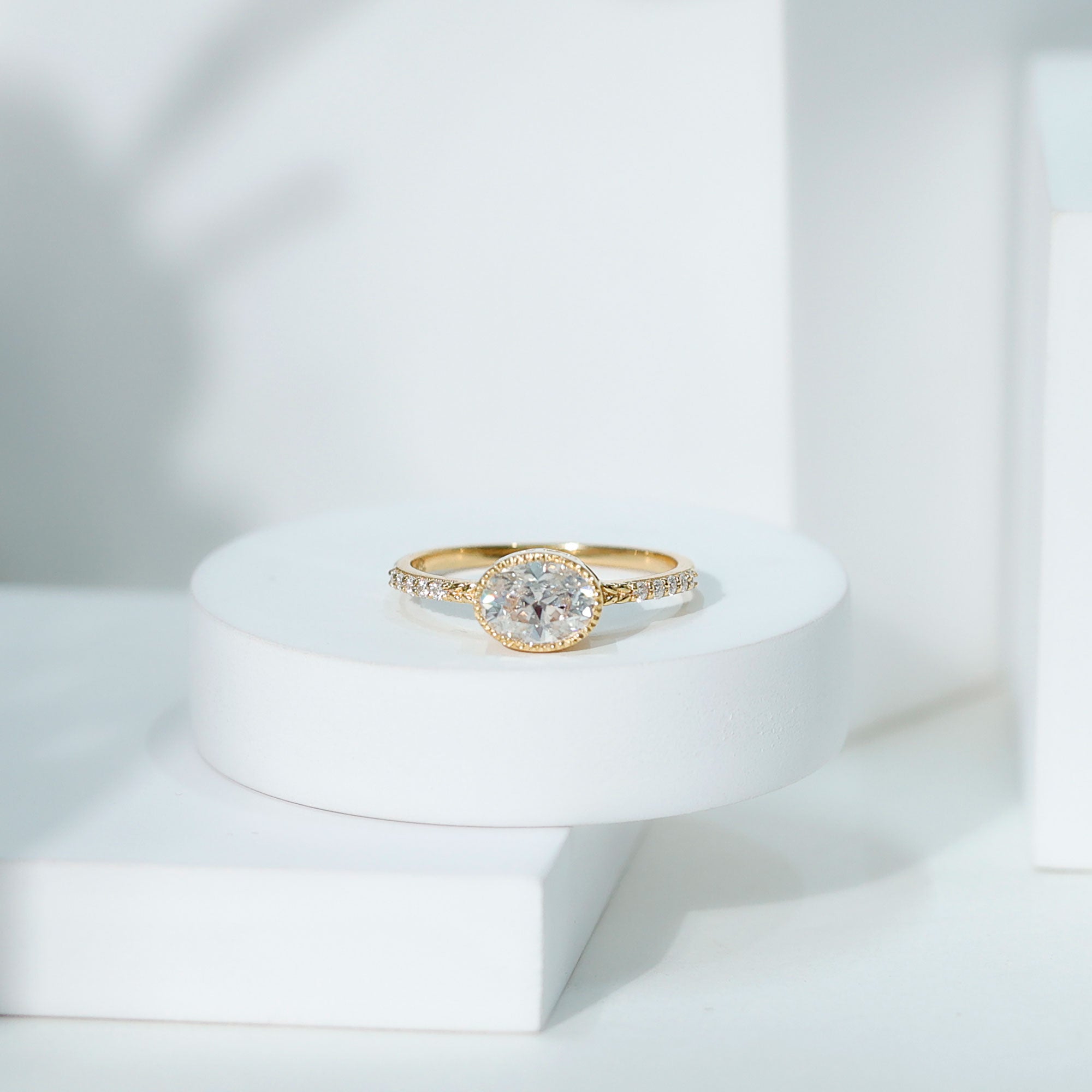 Rosec Jewels-Moissanite East West Engagement Ring in Bezel Setting