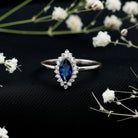 Rosec Jewels-Marquise Cut Lab Grown Blue Sapphire and Diamond Halo Engagement Ring