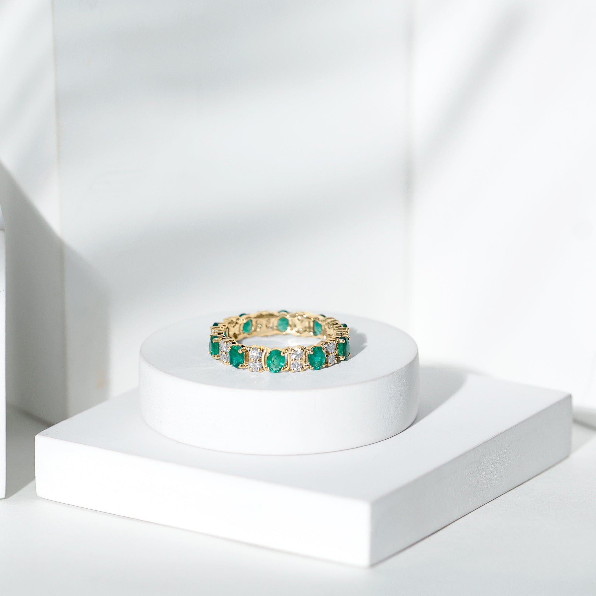 Rosec Jewels-Oval Emerald and Moissanite Eternity Wedding Band
