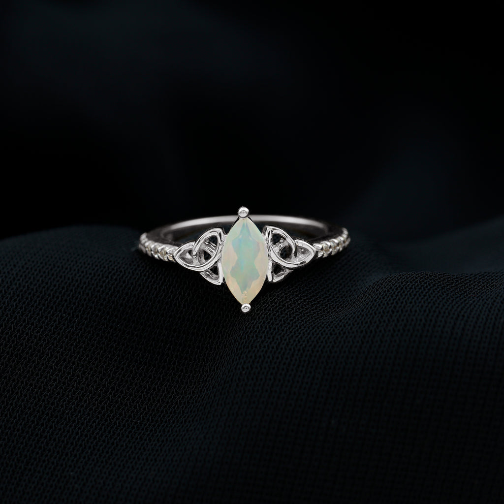 Rosec Jewels - Celtic Knot Solitaire Ring with Marquise Cut Ethiopian Opal and Moissanite in Silver