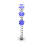 Rosec Jewels-Natural Tanzanite Half Eternity Ring in Bezel Setting