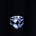 Rosec Jewels-Pear Shaped Tanzanite Moissanite Two Stone Promise Ring in Silver