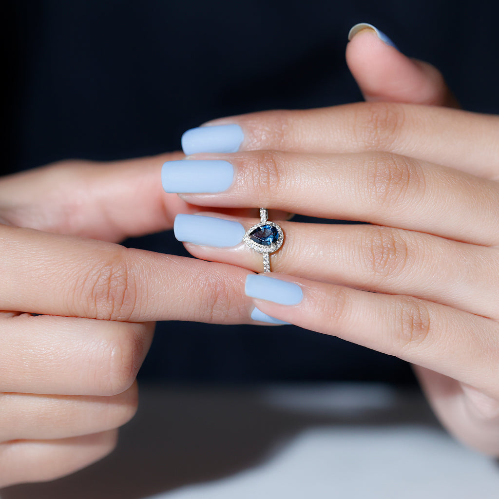 Rosec Jewels - Simple London Blue Topaz Teardrop Ring with Moissanite Halo