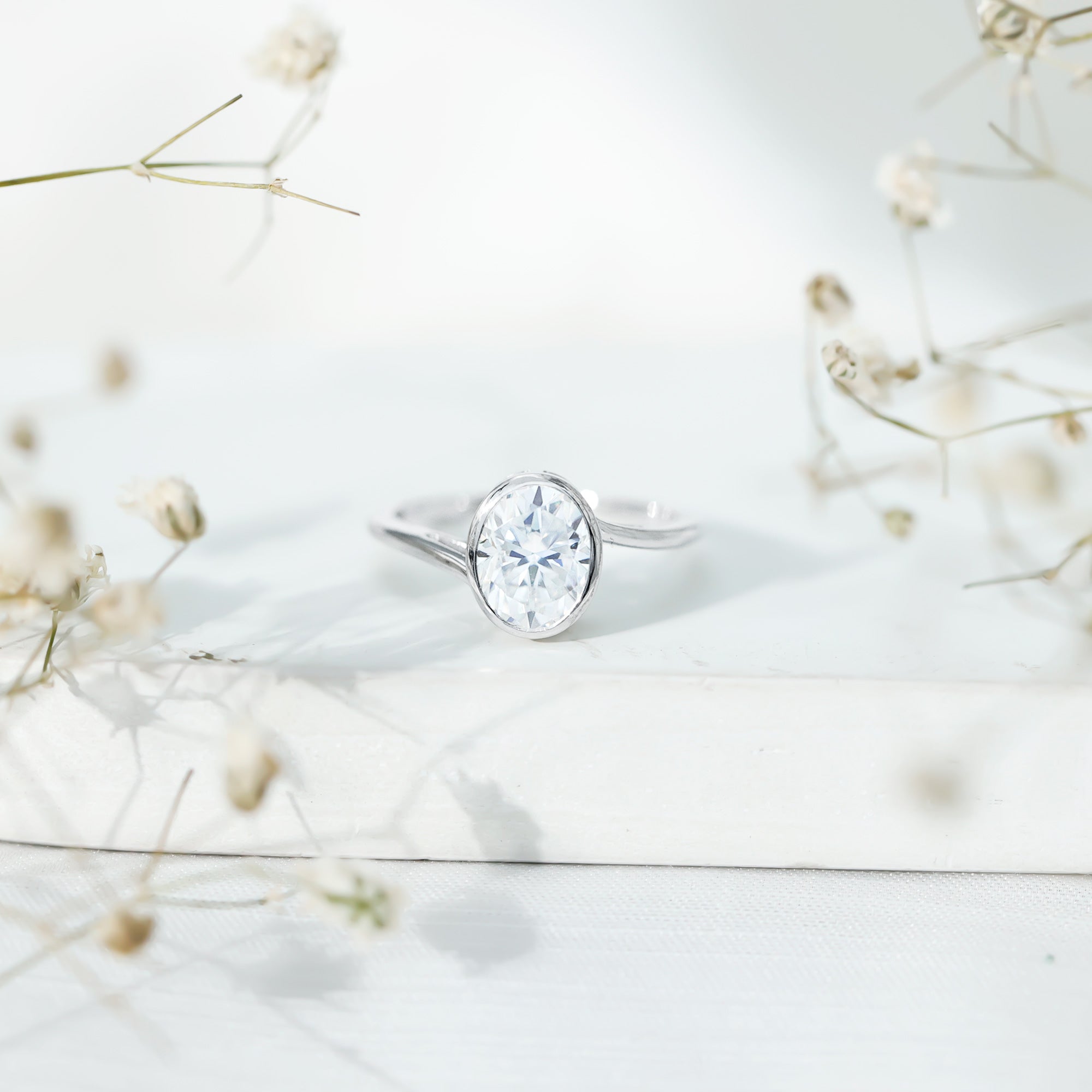Rosec Jewels-Solitaire 7X9 MM Moissanite Oval Engagement Ring with Bypass Shank