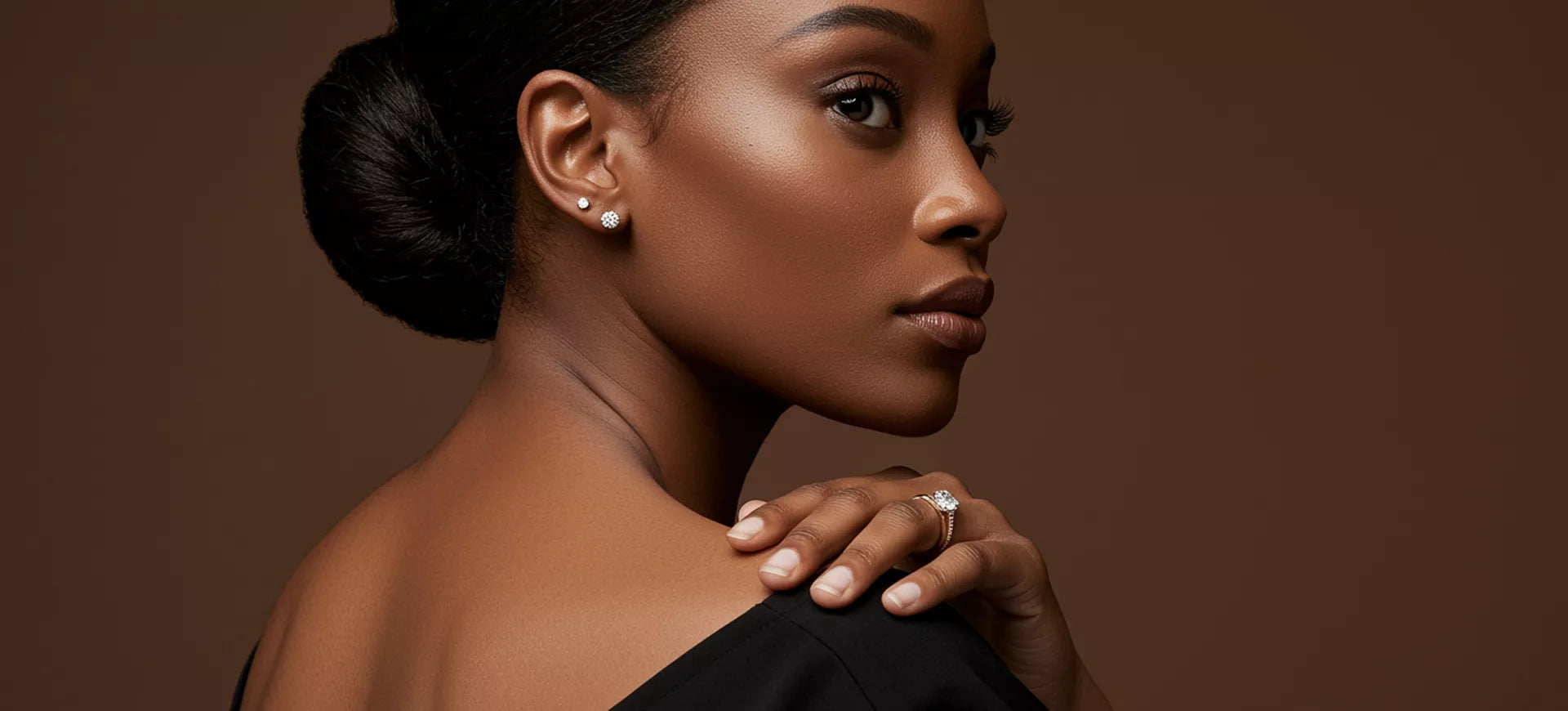  Romantic surprise proposal as a man presents a sparkling diamond engagement ring in an elegant box, while the woman smiles with joy wearing a delicate ring on her hand.