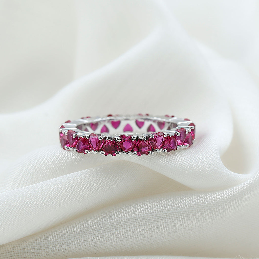 Heart Shape Lab Grown Pink Sapphire Eternity Ring in Claw Setting