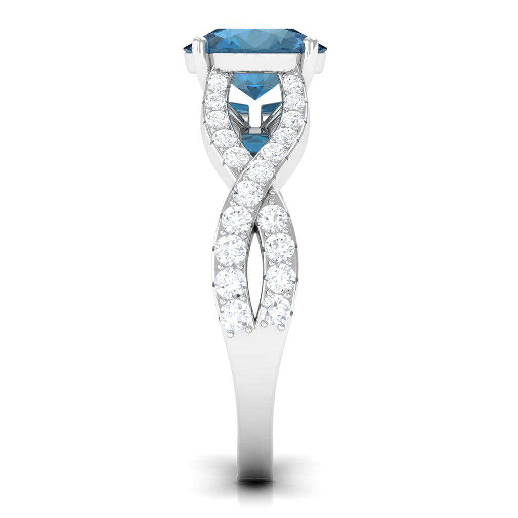 4 Prong Set Solitaire London Blue Topaz Crossover Ring with Moissanite Accent